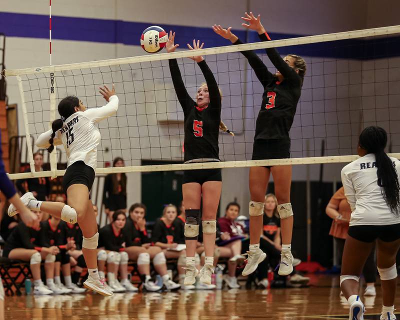 Plano's Aleska Martinez (15) smashes the ball past the defense during volleyball match between Sandwich at Plano.  August 21, 20