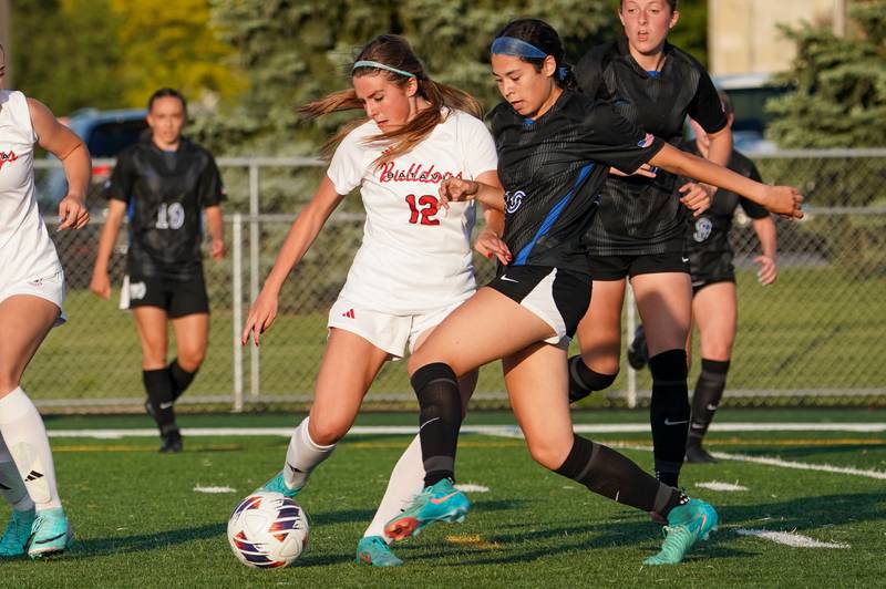 Batavia’s Addison Schaffer (12) challenges St. Charles North's Juliana Park (18) for the ball during a Class 3A Batavia Regional final soccer match at Batavia High School in Batavia on Friday, May 17, 2024.