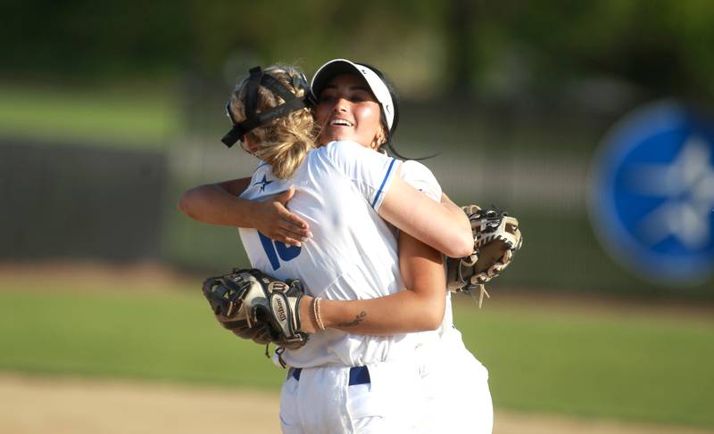 St. Charles North’s Maddie Hernandez celebrates with pitcher Paige Murray following their home game win over Wheaton Warrenville South on Monday, May 6, 2024.