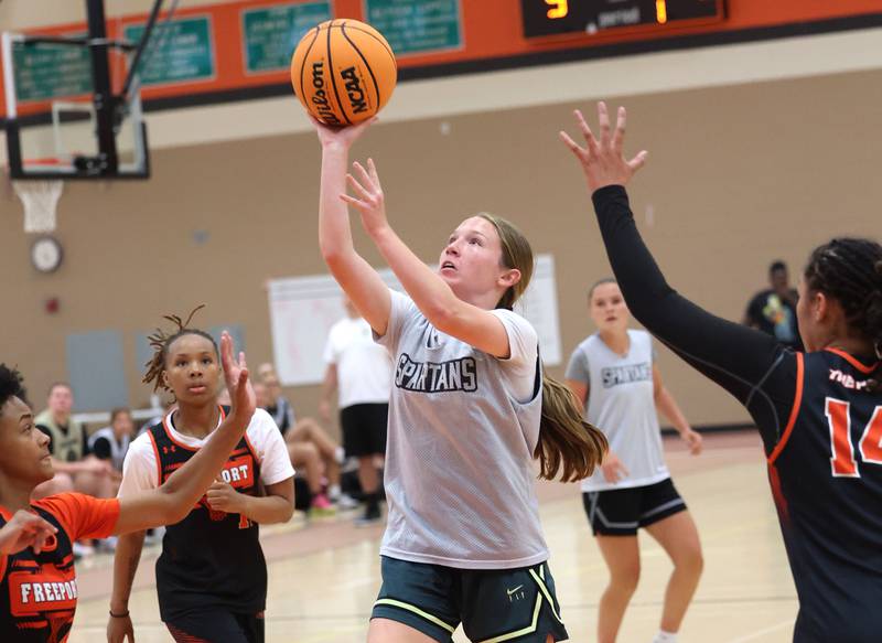 Sycamore’s Cortni Kruizenga goes to the basket during their summer game against Freeport Monday, June 17, 2024, at DeKalb High School.