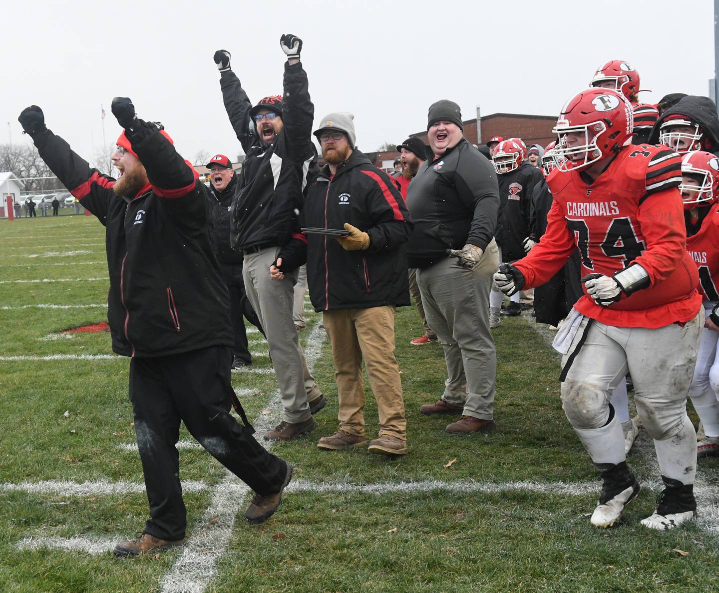 Forreston coach Keynon Janicke (far left) and the rest of the Cardinal sideline reacts to play in the final seconds of their  20-8 win over Dakota in 1A playoff action on Saturday, Nov. 12.