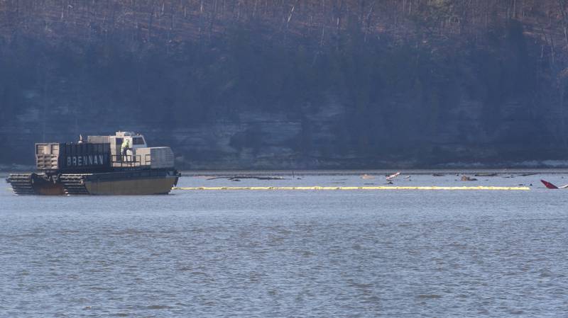 Workers use a amphibious dump truck to haul silt near Delbridge Island about a mile east of the Starved Rock Lock and Dam on Tuesday, Feb. 13, 2024 near Starved Rock State Park. The Starved Rock Breakwater project is a habitat restoration effort designed to restore submerged aquatic vegetation in the Illinois River, Starved Rock Pool. It will increase the amount and quality of resting and feeding habitat for migratory waterfowl and improve spawning and nursery habitat for native fish.
Construction of the breakwater will involve placement of riprap along northern edge of the former Delbridge Island, adjacent to the navigation channel between River Mile 233 and 234. The breakwater structure will be approximately 6,100 feet long and constructed to a design elevation 461.85 feet, providing adequate protection to allow for submerged aquatic vegetation growth.
The estimated total cost of this project is between $5 and $10 million.