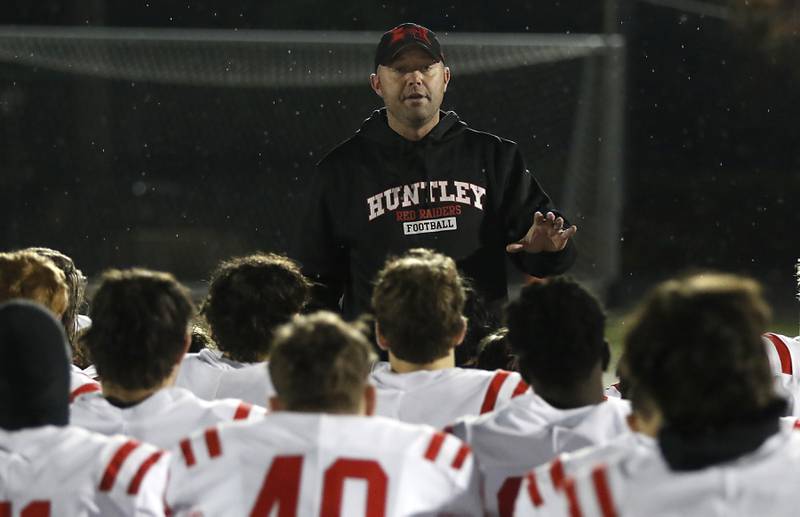 Huntley Head Football Coach Mike Naymola talks with his team after Huntley was defeated by St. Ignatius in a IHSA Class 8A second round playoff football game on Friday, Nov. 3, 2023, at St. Ignatius College Prep in Chicago.