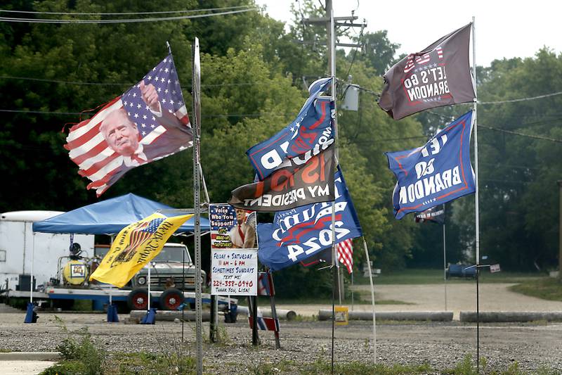 A couple who sets up a booth at Routes 173 and 47 in Hebron to sell t-shirts and other branded apparel said they were harassed by a village trustee on May 27, 2023, and that they have been harassed by police since.