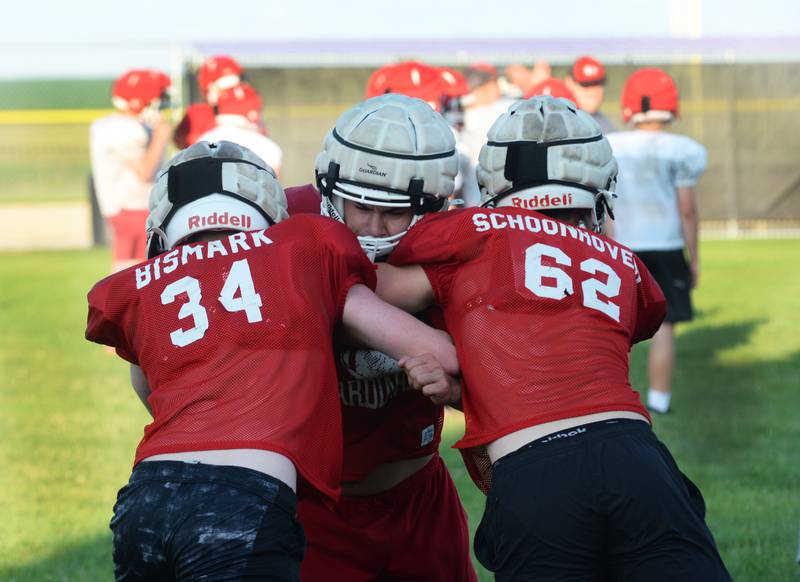 Forreston football players work on a blocking drill during football camp at Forreston High School on Monday, July 29, 2024. The Cardinals open the 2024 season at Fulton on Aug. 30.