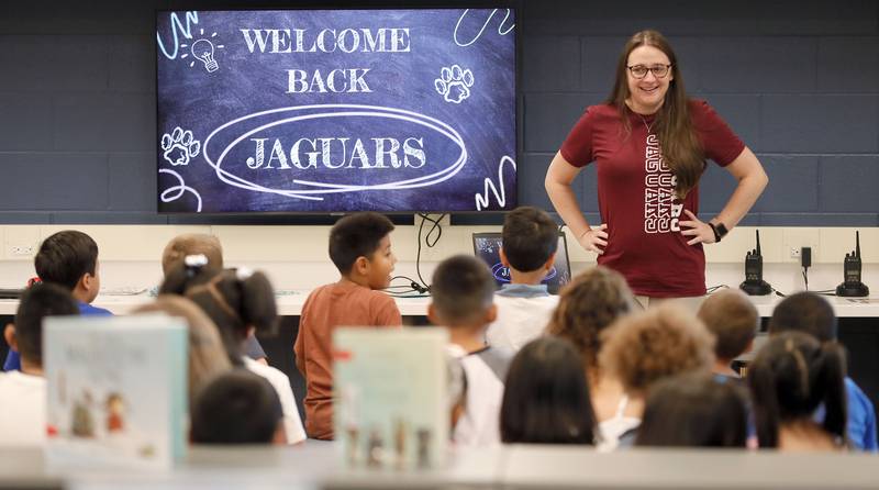 Social Worker Jackie Schramm welcomes students back in the renovated library learning center at Johnson Elementary School Wednesday August 16, 2023 in Warrenville.