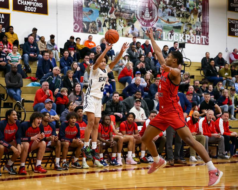 Oswego East's Bryce Shoto (2) shoots a jump shot during Class 4A Lockport Regional final game between West Aurora at Oswego East.  Feb 24, 2023.