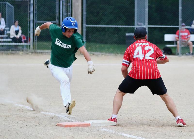 St. Matthews' Ace Christiansen beats a throw to first base in Tuesday's Princeton Park District Fastpitch tournament championship action.