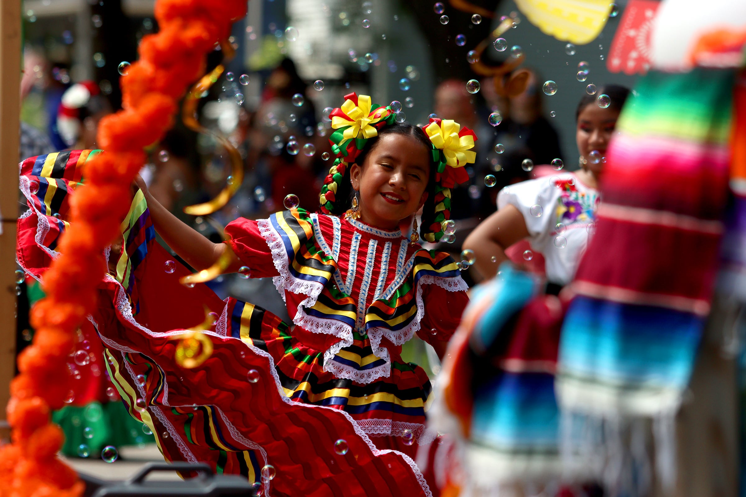 A dancer from Academia de Danza Aztlan performs as part of the Fiesta Days parade along Main Street in McHenry Sunday.