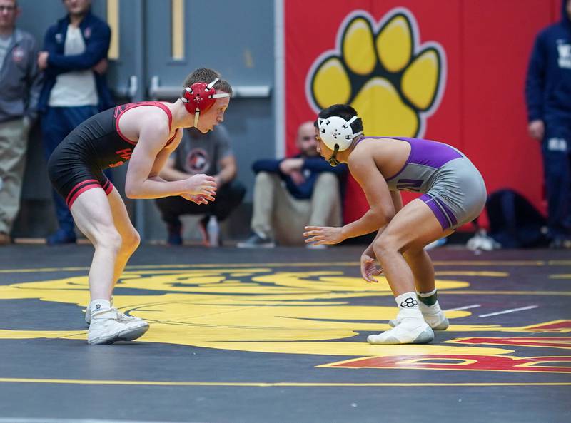 Main South’s Brett Harman (left) circles the mat against Downers Grove North’s Tyler Tiancgo in a 113-pound third place match during The Clint Arlis Invitational Wrestling meet at Batavia High School in Batavia on Saturday, Jan 13, 2024.