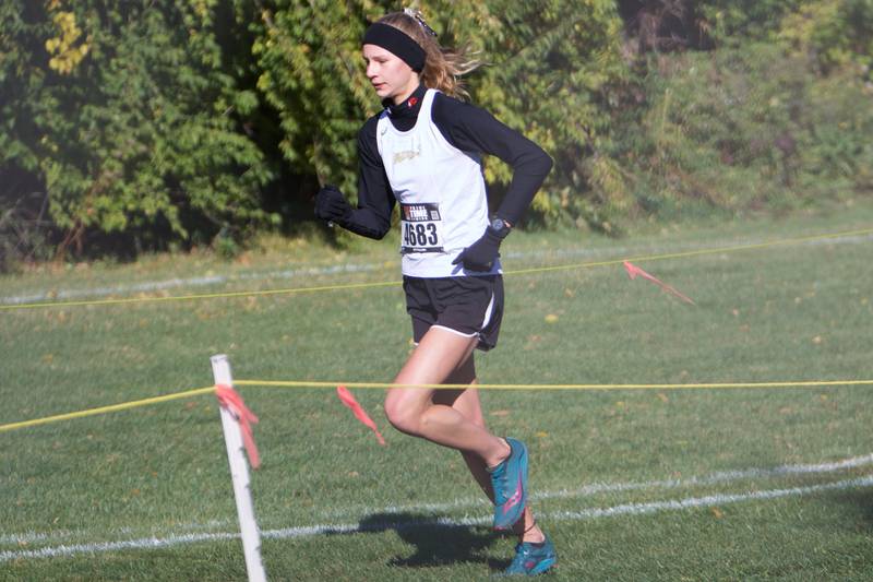 Glenbard North's Grace Schager opens up a lead at the DuKane Conference Cross Country Meet on Saturday, Oct, 15, 2022 in Roselle.