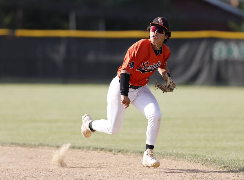 St. Charles East's Mac Paul (14) runs after getting a hit during the Class 4A York regional semi-final between Wheaton Warrenville South and St. Charles East in Elmhurst on Thursday, May 23, 20
