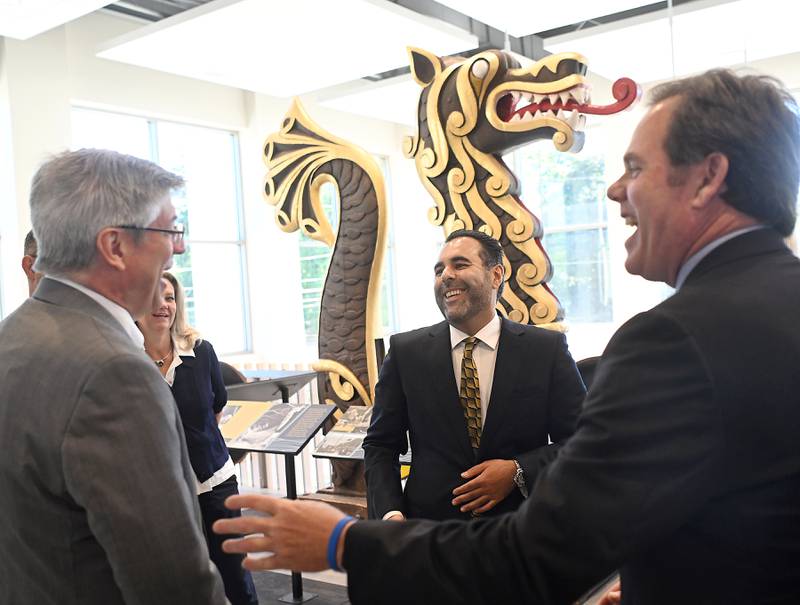 Norway's President of the Storting Masud Gharahkhani, center, laughs with State Rep. Dan Ugaste, left, and Geneva Mayor Kevin Burns as they visit the Geneva Public Library Friday. Gharahkhani first toured the Viking Ship in Good Templar Park then the library to see the head and tail pieces before having roundtable discussions with local business and political leaders. Gharahkhani is touring the midwest before an upcoming NATO summit.The president of the Storting is akin to the Speaker of the House in the United States.