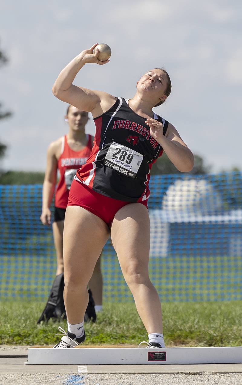 Forreston’s Sydni Badertscher fires the shot in the 1A Shot Put Saturday, May 18, 2024 at the IHSA girls state track meet in Charleston.