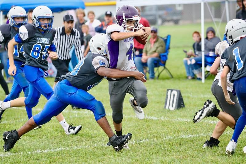Princeton eighth grader Isiah Bellany makes the tackle against Rochelle Saturday.