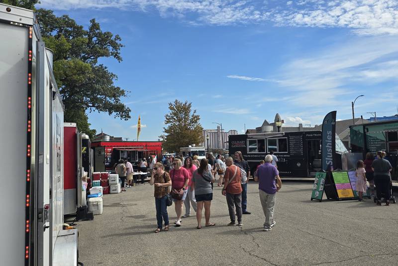 Patrons make their way around to different food trucks Saturday, Sept. 14, 2024, during the Fall Food Truck Festival in Streator's City Park. The festival featured 20 trucks.