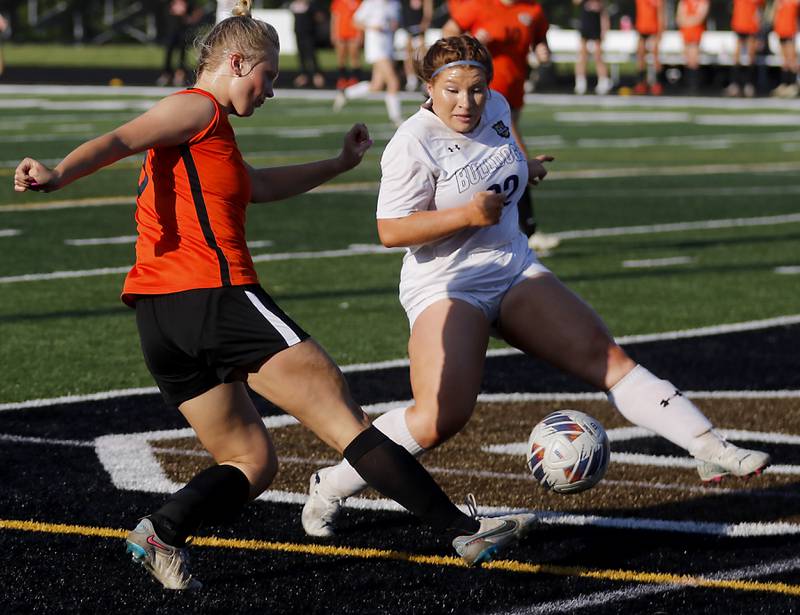 Crystal Lake Central's Lizzie Gray takes a shot at the goal as Wauconda's Caryl Fisher tries to block the kick during the IHSA Class 2A Grayslake North Regional championship soccer match on Friday, May 17, 2024, at Grayslake North High School.