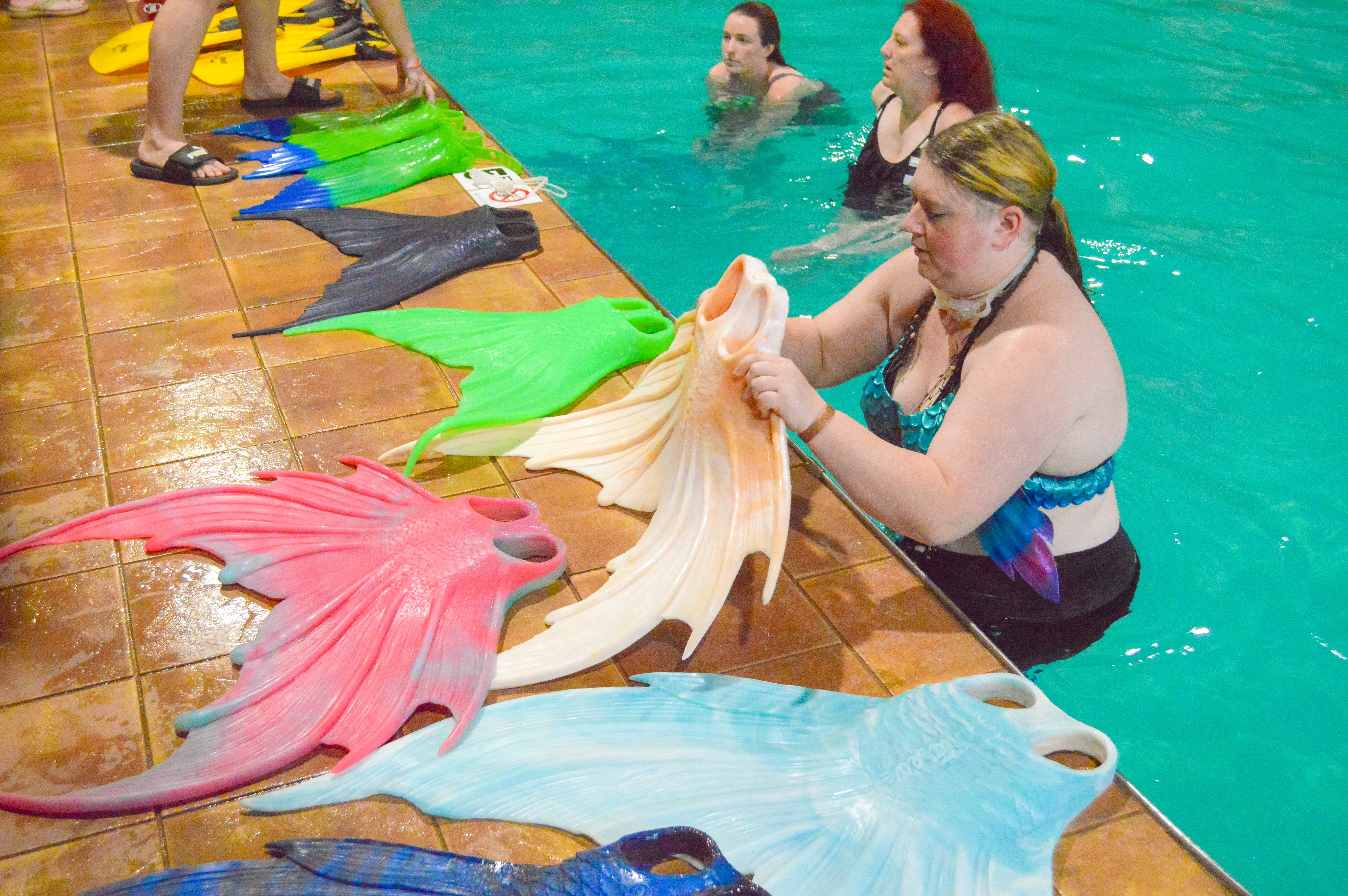 Mer-Pod members try out different fins at the MerCon convention.