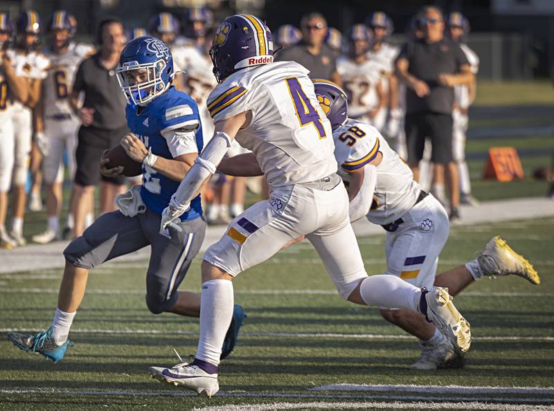 Newman’s Evan Bushman picks up yards against Sherrard Saturday, Sept. 2, 2023 in a game at Sterling High School.