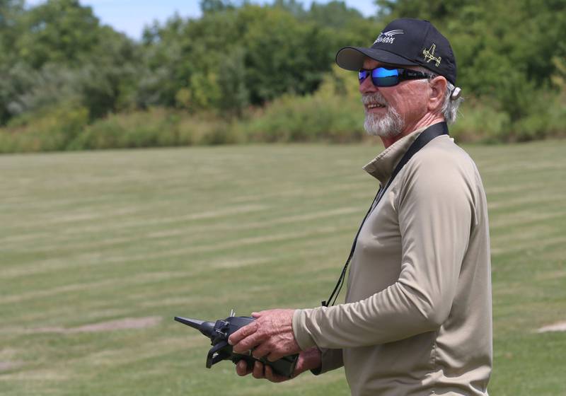 Larry Moore of Oglesby, flies a model airplane on Monday, July 1, 2024 at the Model Airplane Field in Matthiessen State Park. The Deer Park RC Flyers radio-controlled aircraft club maintains the model airplane field and flys model airplanes at the site.