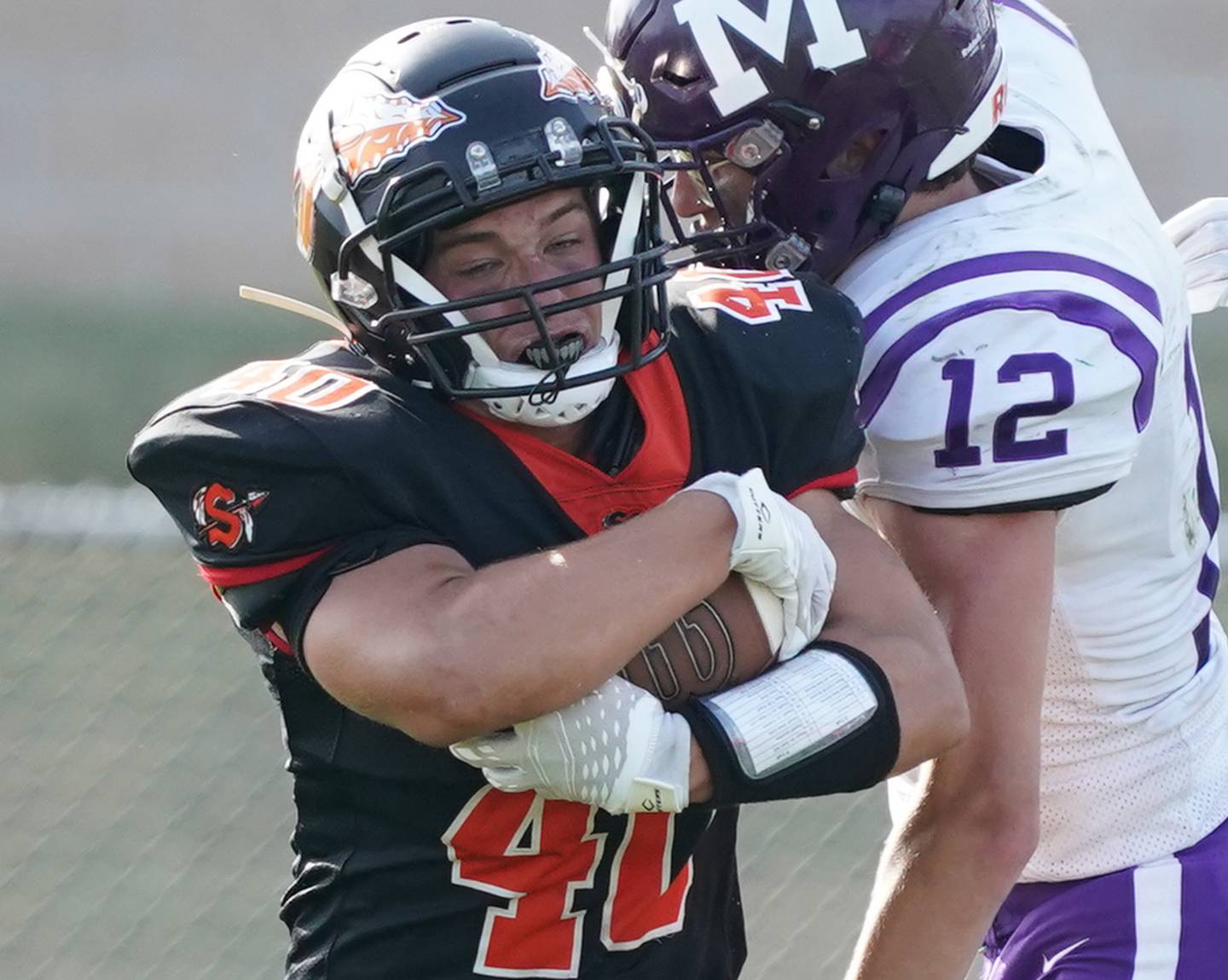 Sandwich Parker Anderson (40) carries the ball against Manteno during a football game at Sandwich High School on Saturday, Aug 26, 2023.