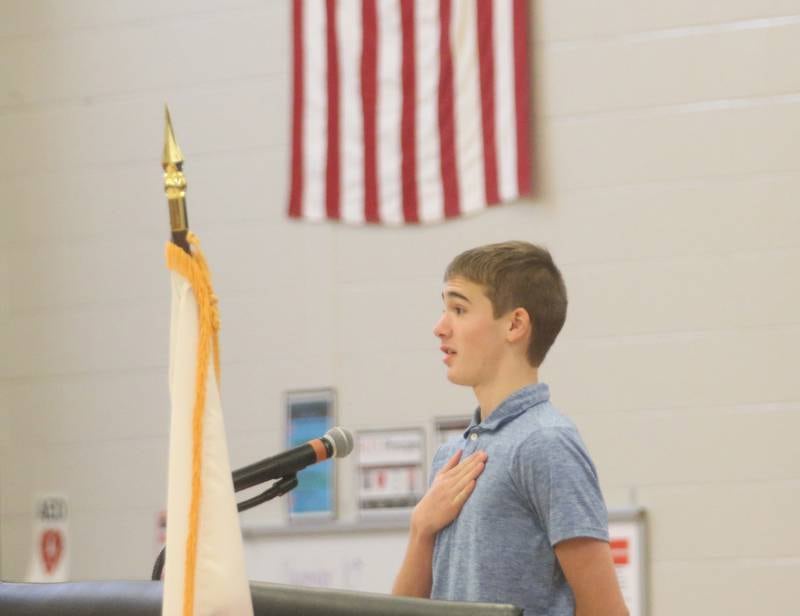 Briggs Brown an eighth-grade student at Parkside Middle School recites the Pledge of Allegiance during the Parkside School Veterans Day Program on Friday, Nov. 10, 2023 at Parkside Middle School in Peru.