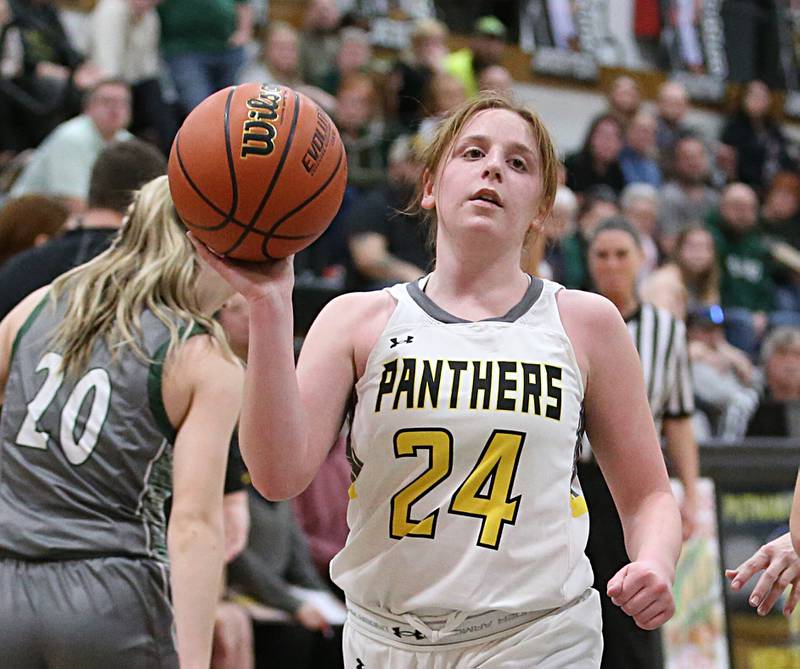 Putnam County's Gracie Ciucci looks to pass the ball around Midland's Toree Meinders during the Class 1A Regional game on Monday, Feb. 13, 2023 at Putnam County High School.