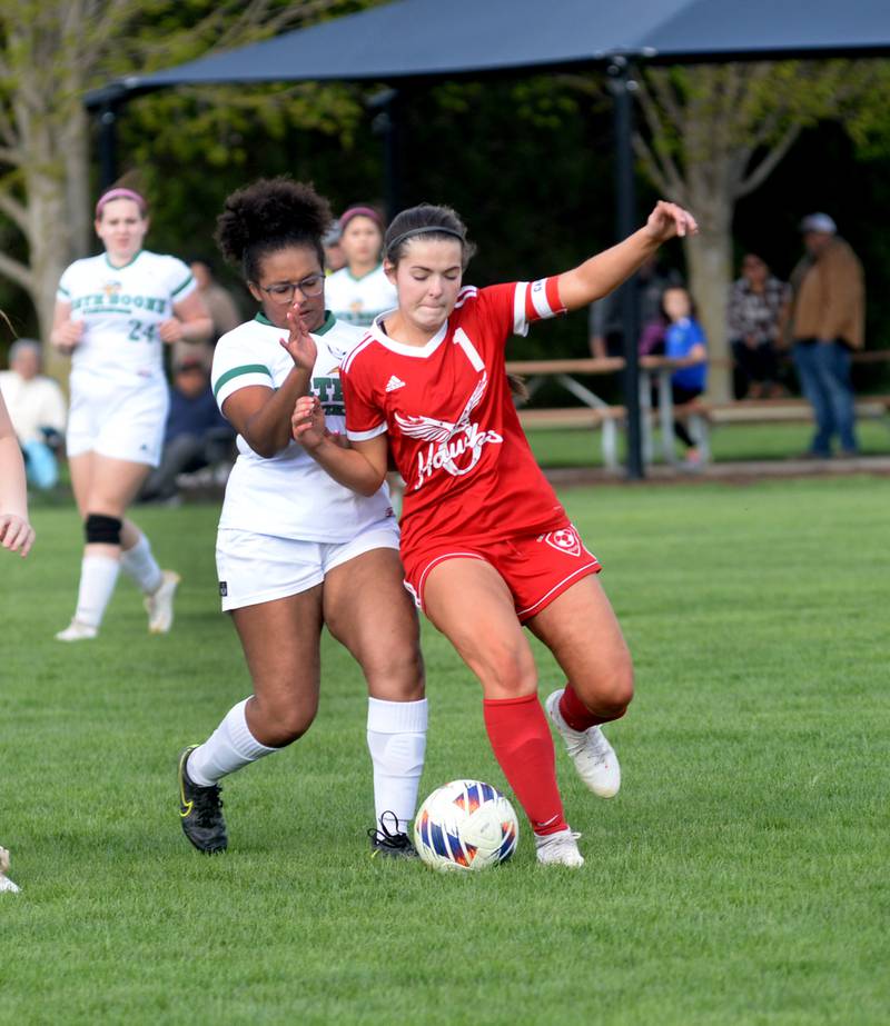 Oregon's Mya Engelkes battles a North Boone player for the ball during a Tuesday, April 23, 2024 game at Oregon Park West.