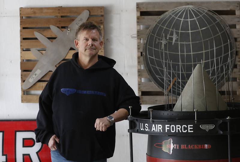 Kurt Eldrup, a former U.S. Air Force reservist who also served in Operation Desert Storm, uses airplane parts to make custom furniture, fans and even a fish tank at his business, Phighter Images Inc., in McHenry.