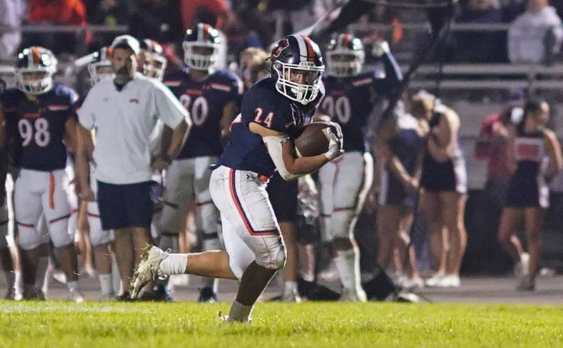 Oswego’s Ayden Villa (24) carries the ball for a touchdown against West Aurora during a football game at Oswego High School on Friday, Sept. 29, 2023.