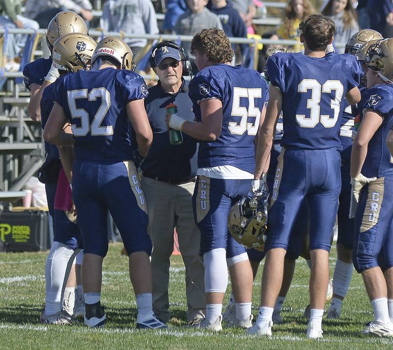 Head Coach Tom Jobst talks with the defense during a time out  in the 2nd quarter during the Class 1A first round playoff game on Saturday, Oct. 29, 2022 at Gould Stadium in Ottawa.