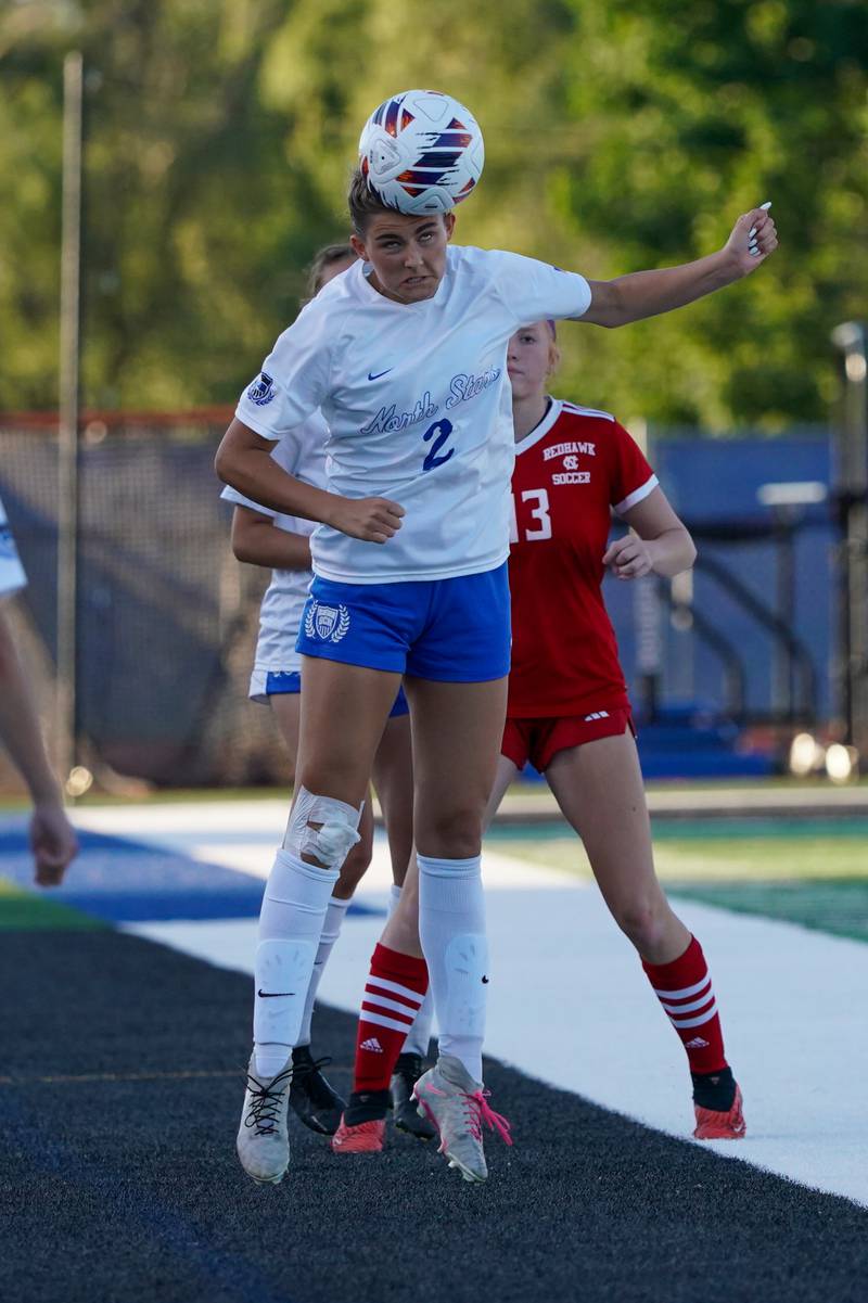 St. Charles North's Kayla Floyd (2) goes up for a header against Naperville Central during a Class 3A St. Charles North Supersectional soccer final match at St. Charles North High School on Tuesday, May 28, 2024.