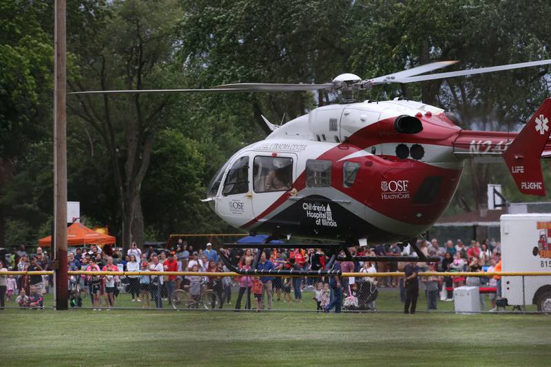 OSF Lifeflight helicopter lands at Kirby Park in Spring Valley during  the National Night Out event on Tuesday, Aug. 6, 2024 .