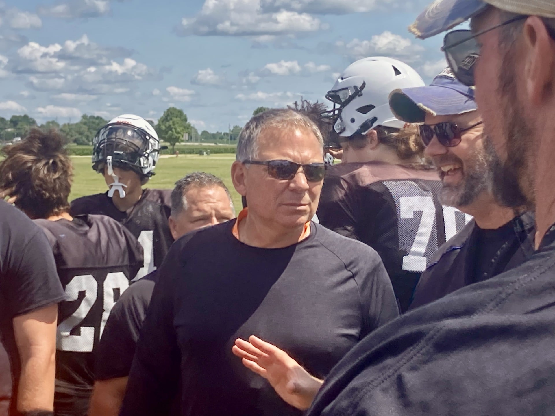 Washington head coach Todd Stevens, a PHS alum, chats with Princeton head coach Ryan Pearson during the controlled practice/scrimmage at Little Siberia Field on Thursday, July 18.