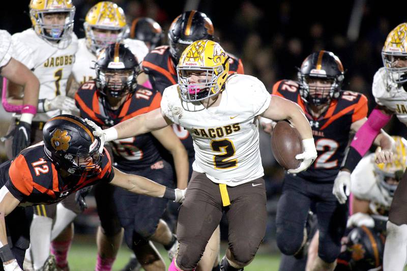 Jacobs’ Caden DuMelle looks for running room in varsity football at Metcalf Field on the campus of Crystal Lake Central Friday night.