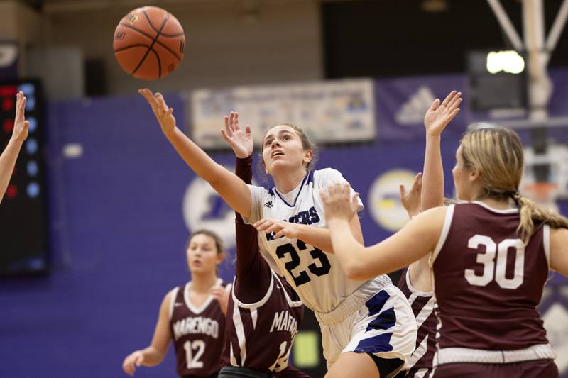 Plano's Josie Larson (23) puts up a shot over Marengo defender Macy Noe (30) during a 2023 game in Plano.