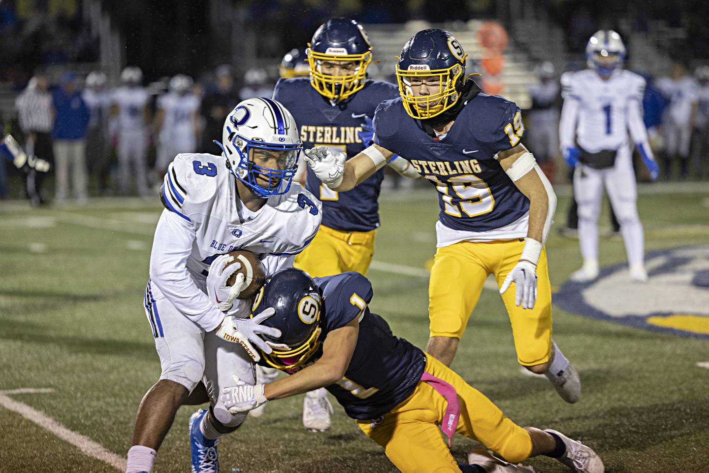 Quincy’s Jeraius Rice fights of a tackle from Sterling’s Joseph Holcomb Friday, Oct.6, 2023 in Sterling.