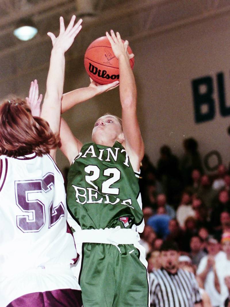 St. Bede's Morgan Cawley looks to shoot over a Rockridge player during the Sectional game on Feb. 14, 2000.