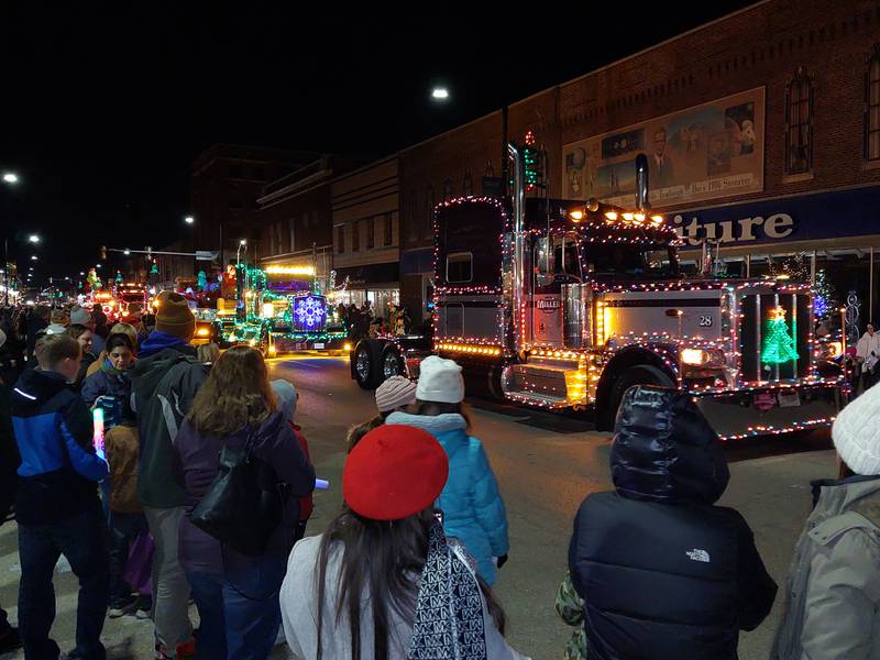 A line of lighted semi tractor trailers rolls along the Streator Lighted Christmas Parade route Saturday, Nov. 25, 2023, on Main Street.