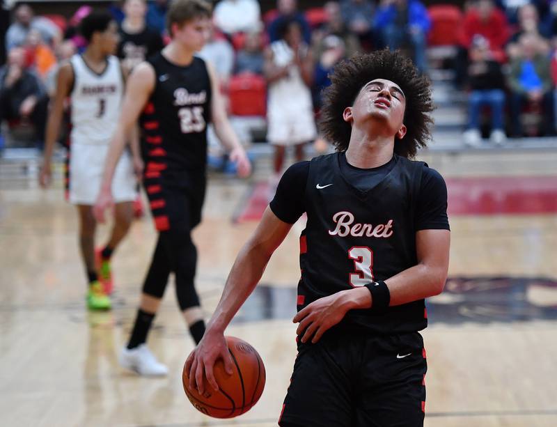 Benet's Jayden Wright reacts after retrieving the ball on an over and back situation during a Class 4A East Aurora Sectional semifinal game against Bolingbrook on Feb. 27, 2024 at East Aurora High School in Aurora.