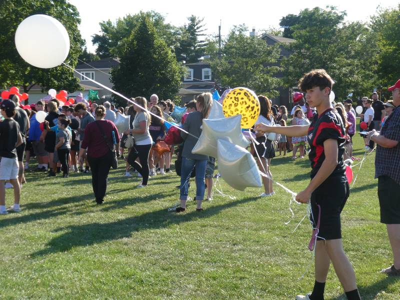 A prayer vigil and balloon release was held at Oriole Park in Chicago on Monday night, August 1, 2022 to mourn the loss of seven killed, including Lauren Dobosz and her four children, in a tragic car crash that occurred Sunday on I-90 near Hampshire.