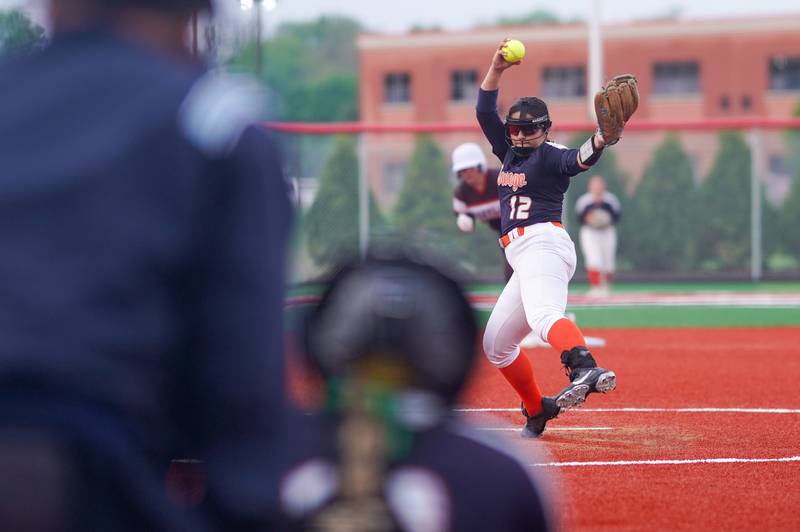 Oswego’s Aubriella Garza (12) delivers a pitch against Yorkville during a softball game at Yorkville High School on Thursday, May 9, 2024.