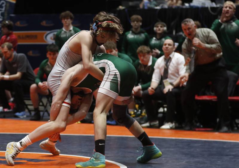 Marian Central’s Austin Hagevold tries to control Coal City’s Owen Petersen during the 106-pound match in the IHSA Class 1or2A Dual Team Sate Championship match Saturday, Feb. 24, 2024 at Grossinger Motors Arena in Bloomington.