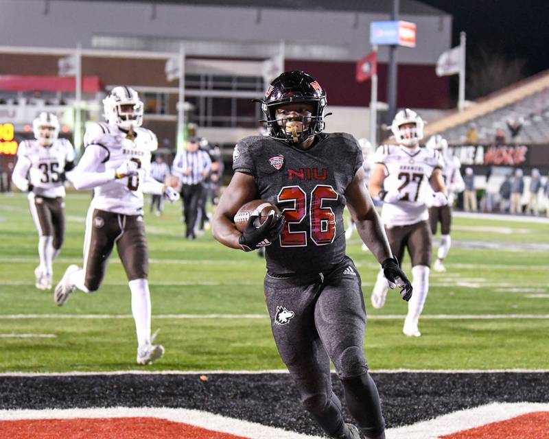 NIU running back Antario Brown (26) runs in for a touchdown in the fourth quarter Tuesday Nov. 23rd while taking on Western Michigan.