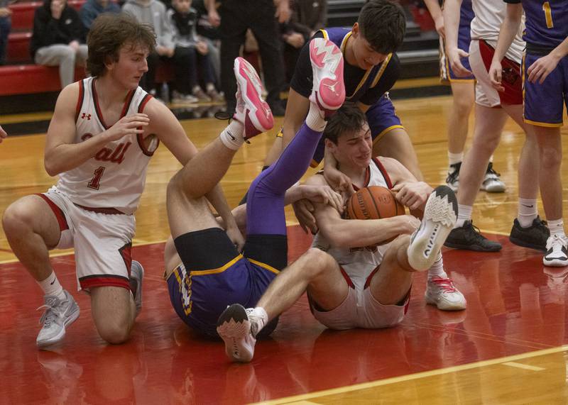 Hall High School's Braiden Curran fights for control of the ball during the IHSA Class 2A Hall Regional quarterfinal at Hall High School on Feb. 19, 2024.