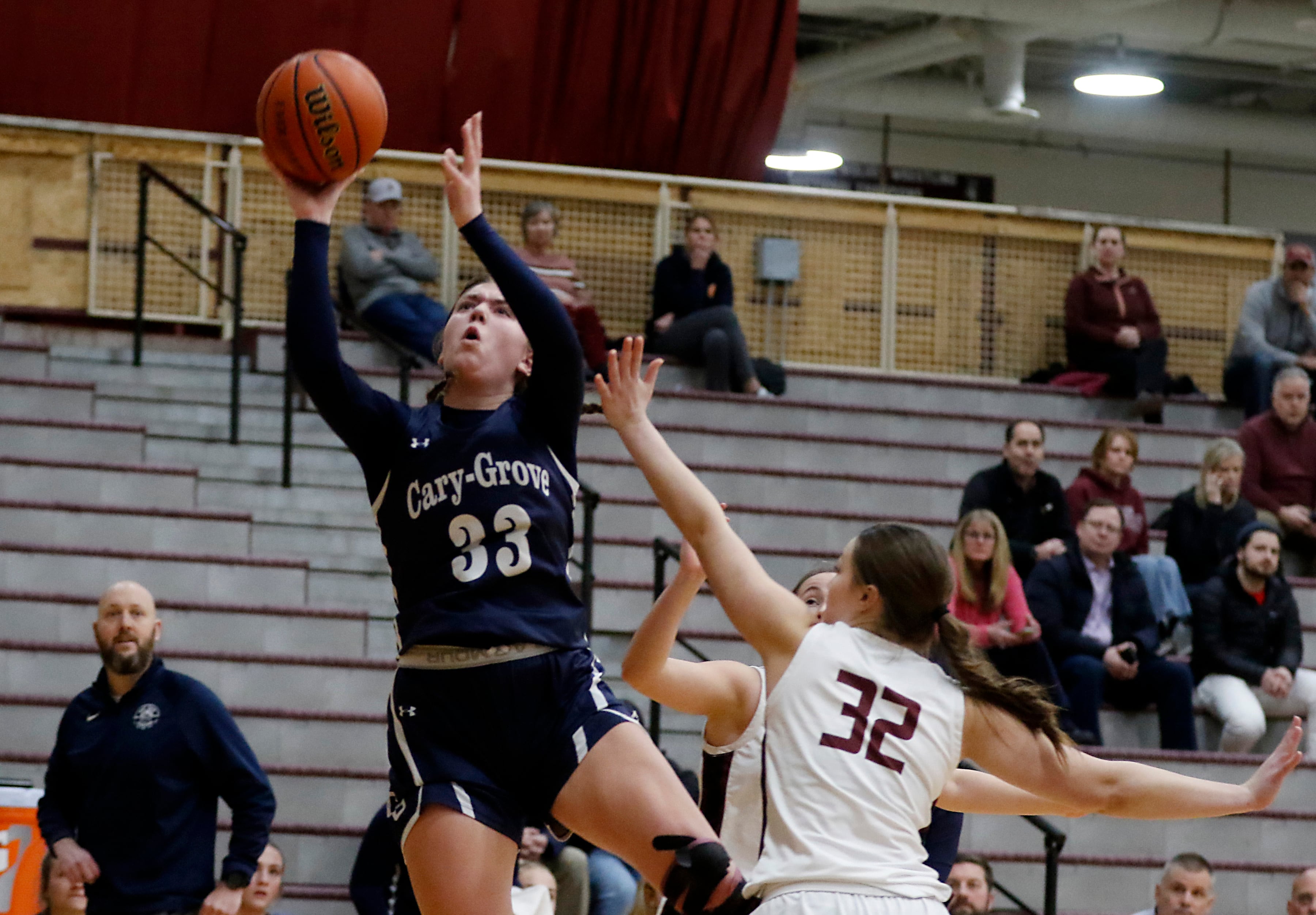 Cary-Grove's Ellie Mjaanes drives to the basket against Prairie Ridge's Addi Gertz during a Fox Valley Conference girls basketball game Wednesday, Jan. 17, 2024, at Prairie Ridge High School.