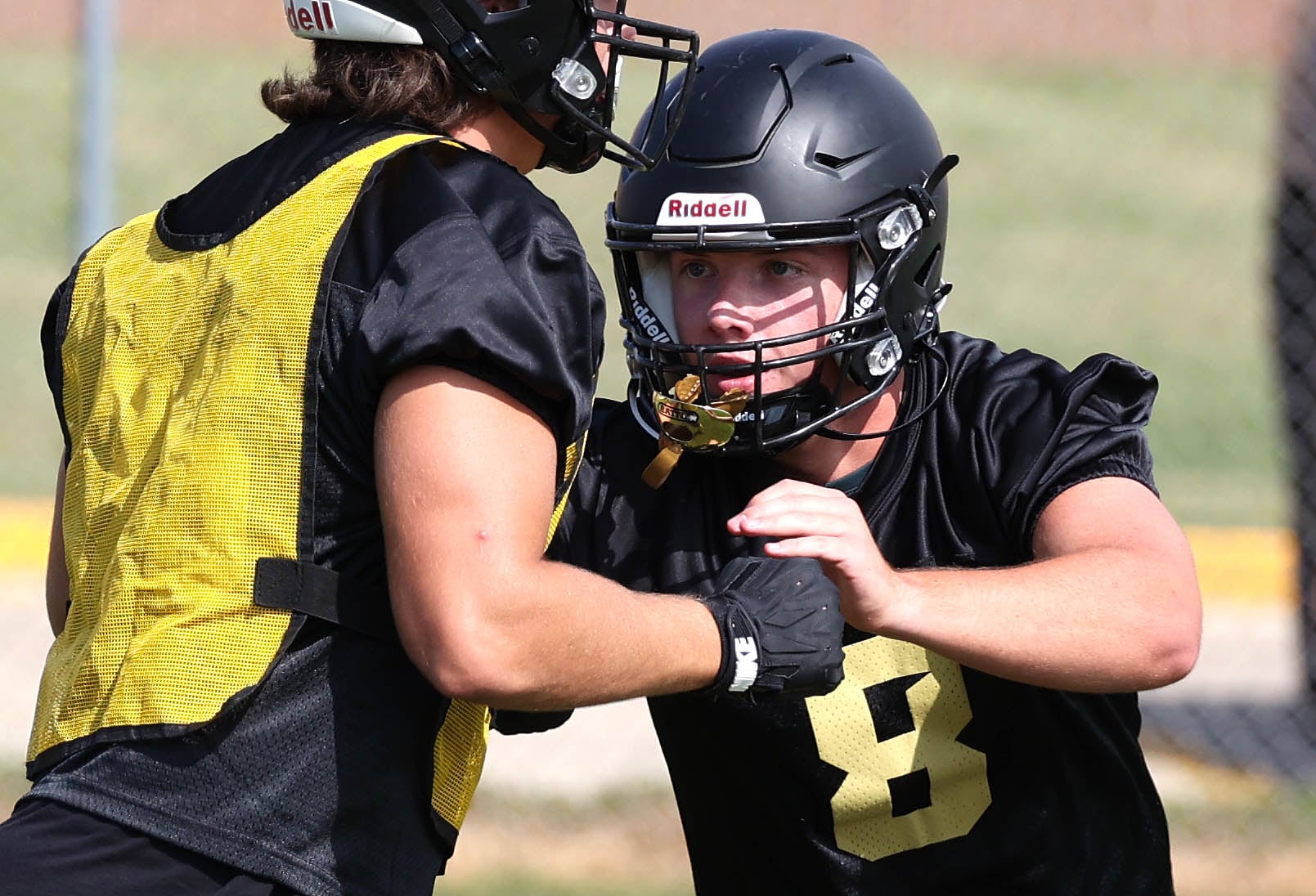 Sycamore’s Ethan Keicher blocks as they run through a play Monday, Aug. 12, 2024, during the first practice of the regular season.