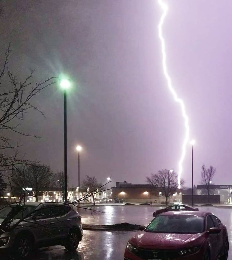 A lightning strike touches down Tuesday night in Crystal Lake while a tumultuous thunderstorm brings sheets of rain, powerful winds, hail and tornado warnings throughout McHenry County.
