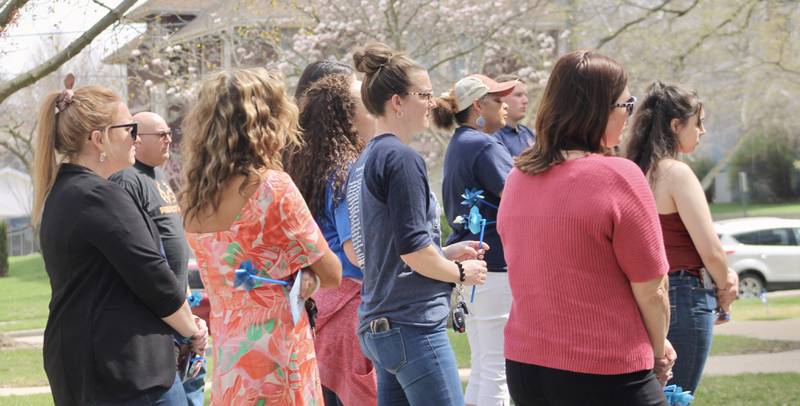 A portion of the crowd of about 50 people who gathered on the grounds of the Old Lee County Courthouse on Friday, April 14, 2023, to observe National Child Abuse Prevention Month.