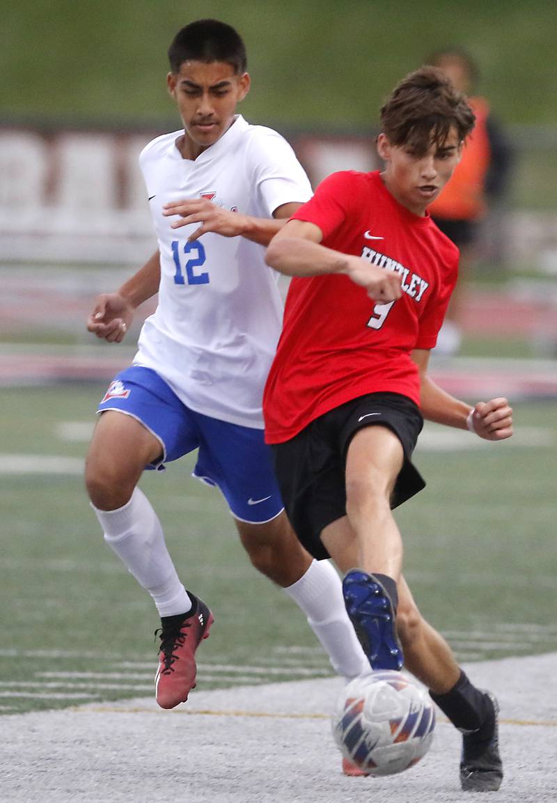 Huntley's Anthony Frelas kicks the ball as he is defended by Larkin's Alexander Hernandez during a nonconference soccer match on Thursday, Sept. 5, 2024, at Huntley High School.